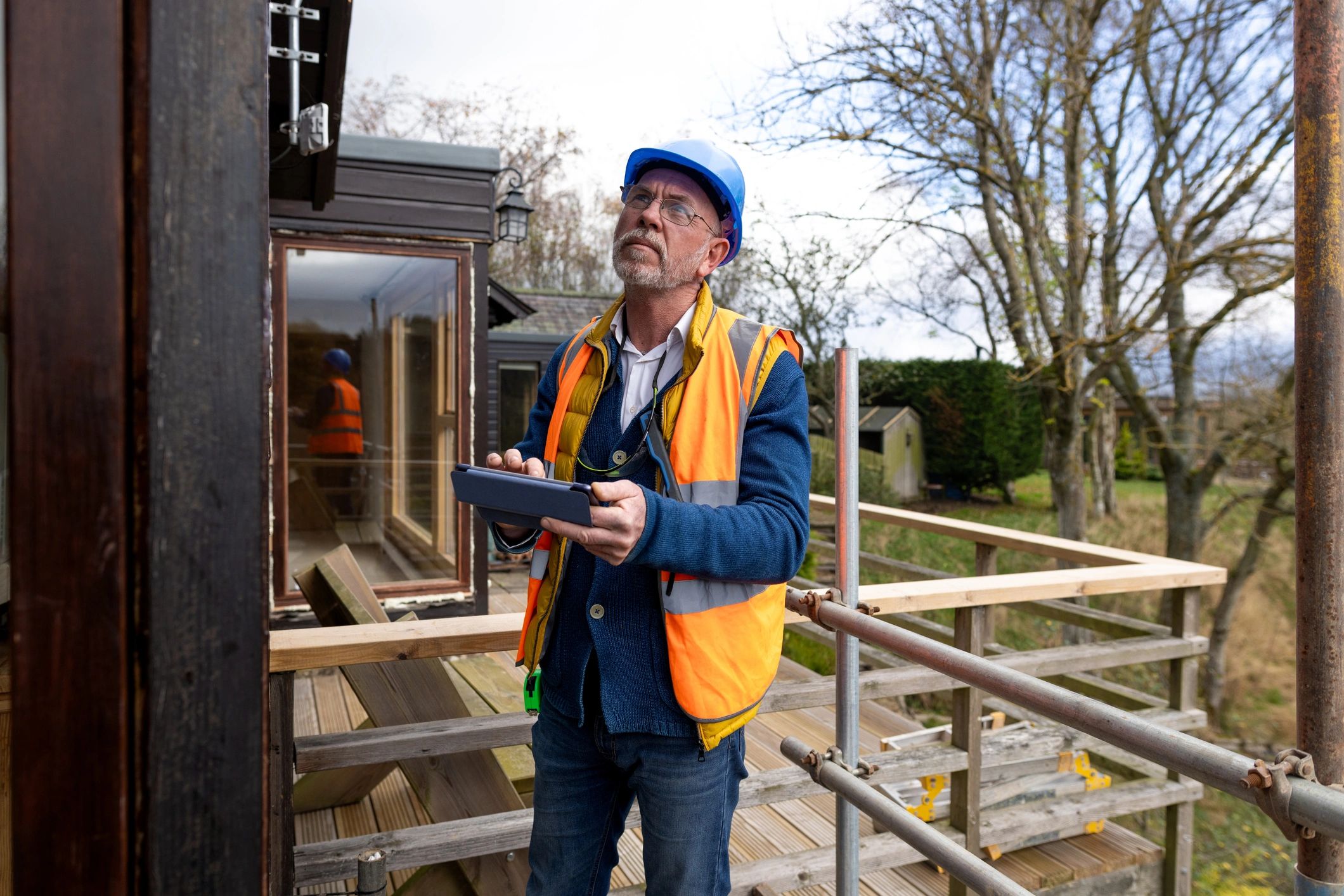 Inspector reviewing site data on a tablet