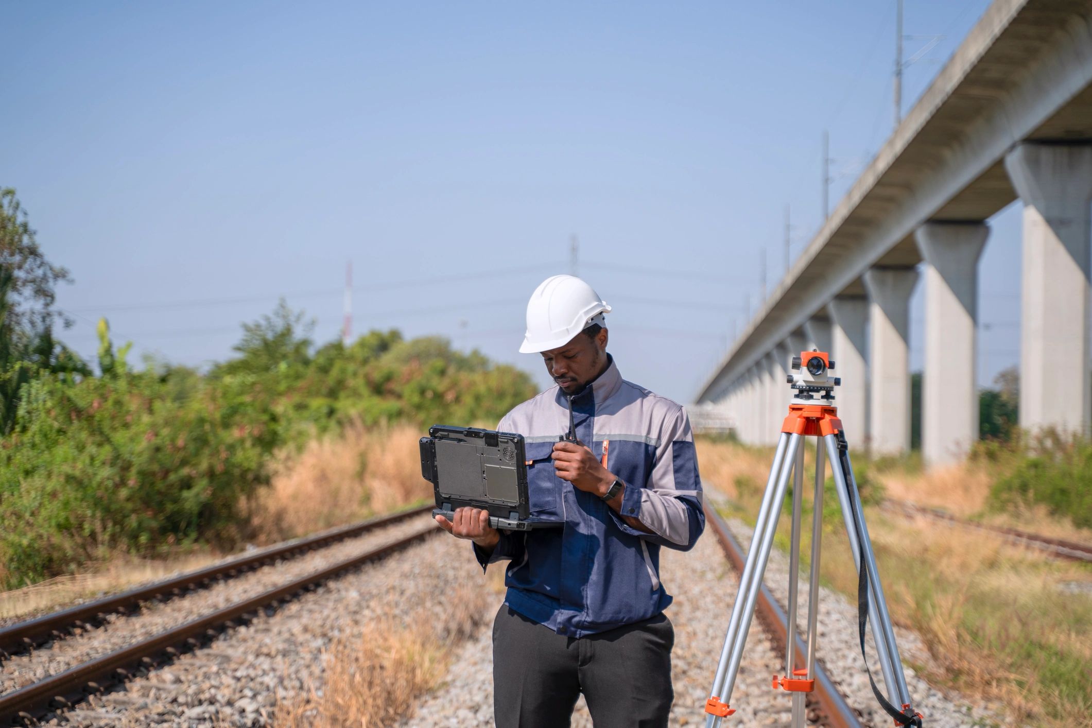 Engineer using electronic tools for field inspection